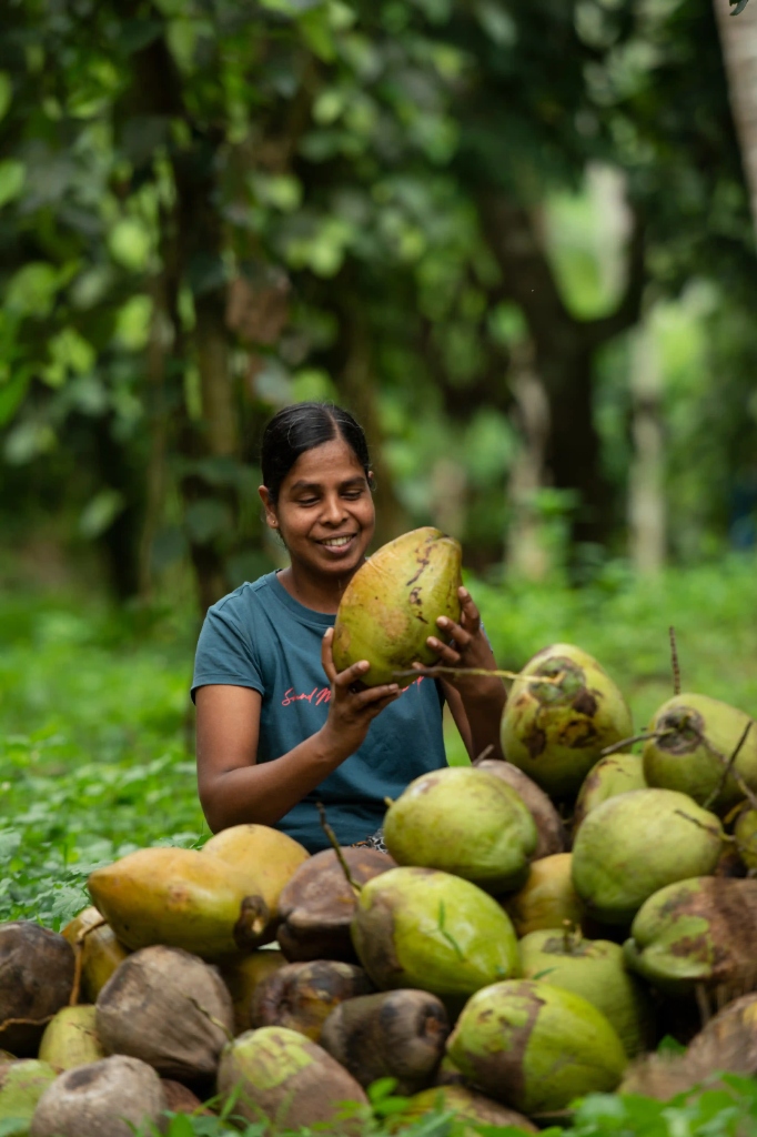 Sourcing Partner holding coconut